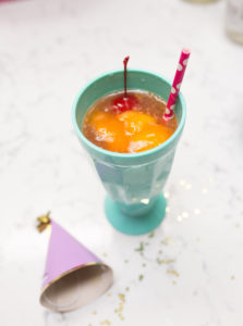 mango sorbet lemon cherry fizz malibu rum summer cocktail with pretty paper straw cherry man cherries