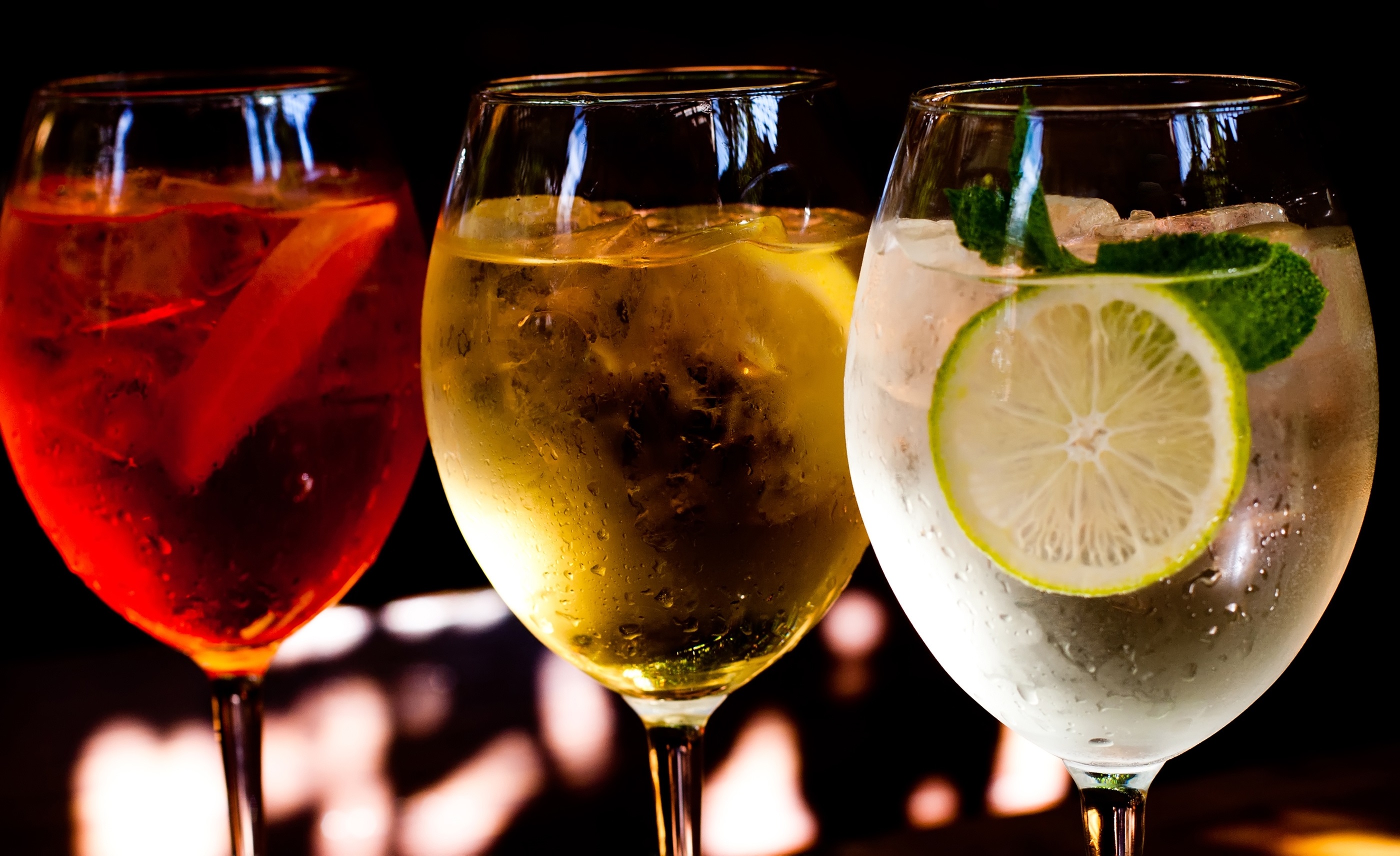 Cocktails: aperol spritz, sprizz (spriss), Martini royale. (dark background). Sparkling wine. Champagne.
