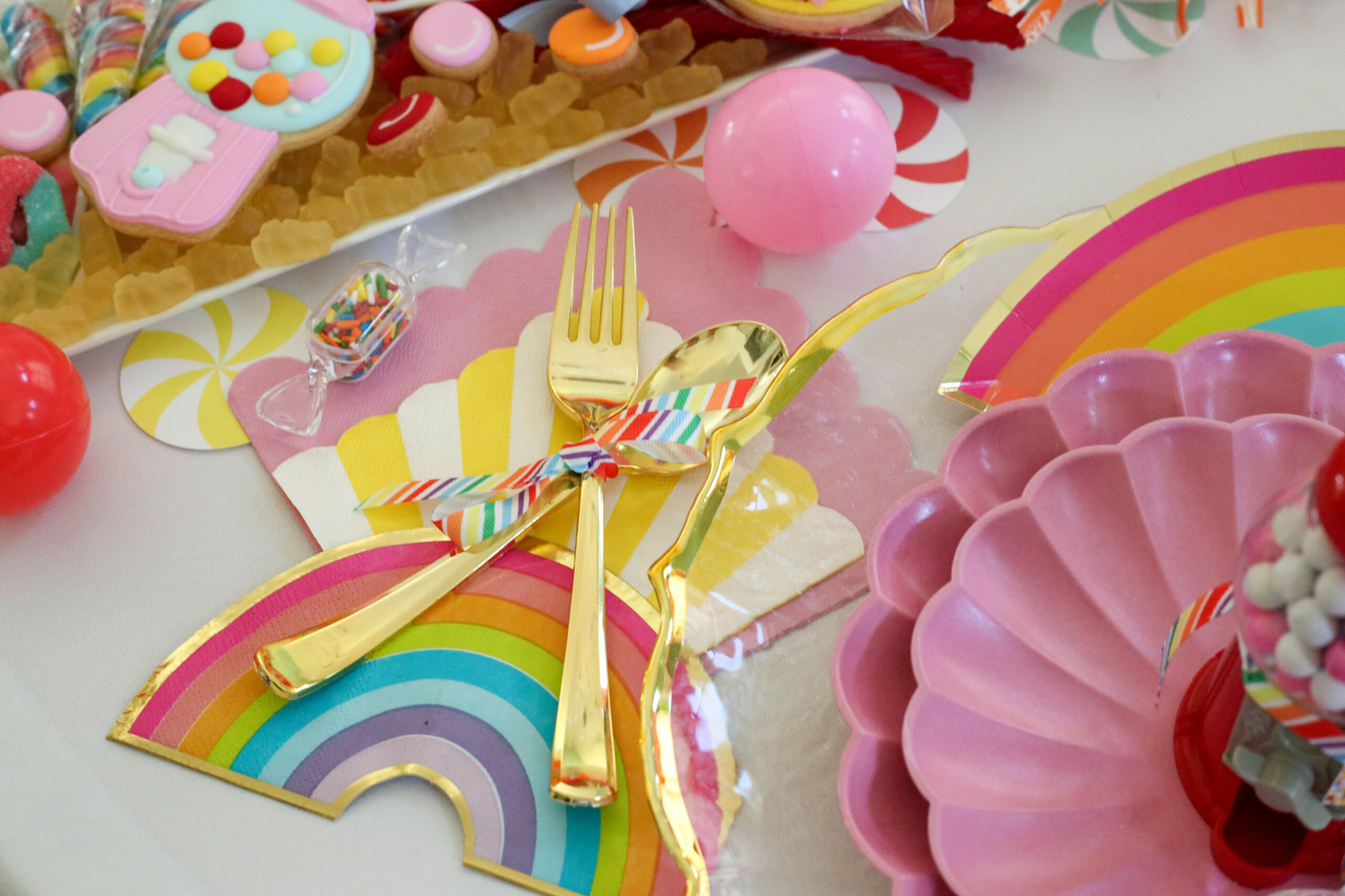 disposable gold flatware tied with ribbon grosgrain rainbow